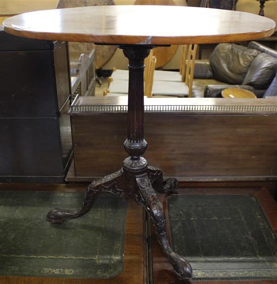 Oval occasional mahogany table, carved tripod base